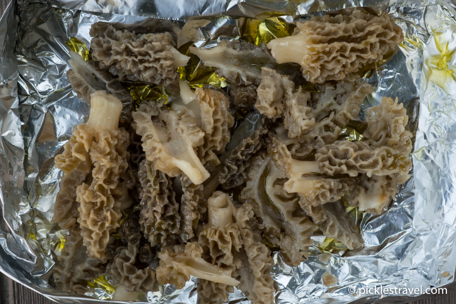 An aluminum foil boat for morel mushrooms and olive oil