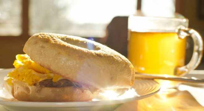 Happy sunny morning breakfast with egg bagel sandwich